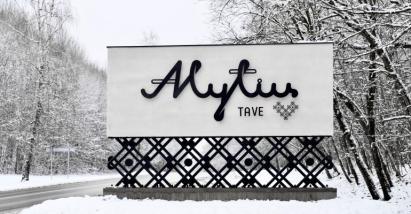 A winter scene featuring a large sign